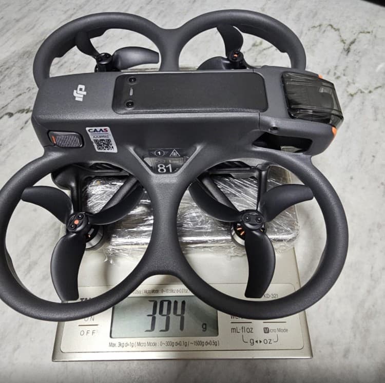 A drone resting on a scale during Brian's setup process.